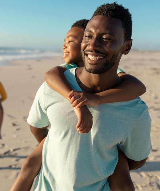 Father and son playing in a beach